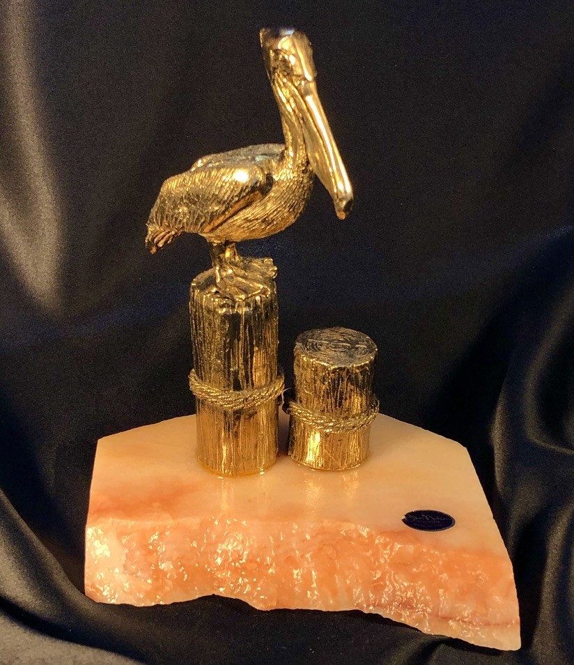 24K Gold plated 7"pewter sculpture on Pink Onyx. Aquatic Series 1974. Original Price $35. Present value (2023) VF $350.; G $175.; R $75